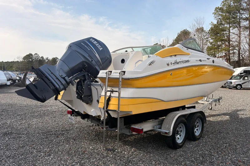 Slide: The Image of 2008 Hurricane SunDeck 2000 OB boat with Yamaha outboard motor on trailer. - 3