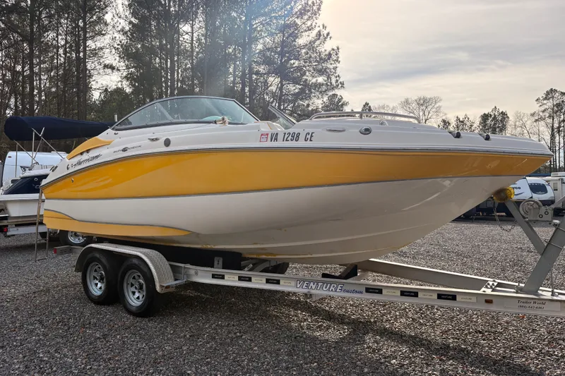 Slide: The Image of 2008 Hurricane SunDeck 2000 OB boat on trailer outdoors. - 4