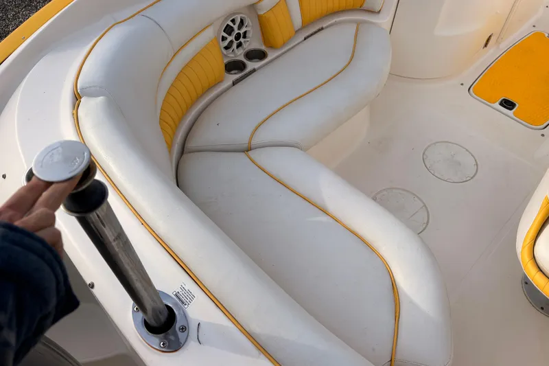 Slide: The Image of 2008 Hurricane SunDeck 2000 OB boat interior with white and yellow seating. - 8