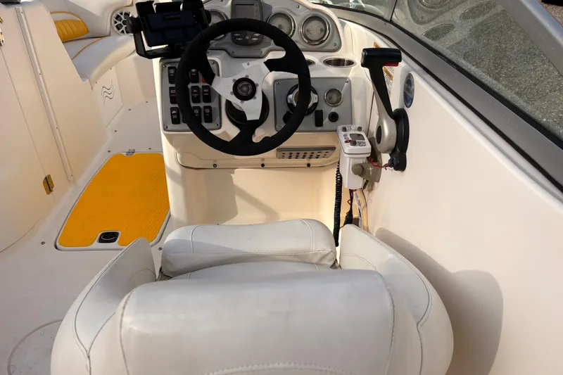 Slide: The Image of 2008 Hurricane SunDeck 2000 OB boat cockpit with steering wheel and controls. - 9