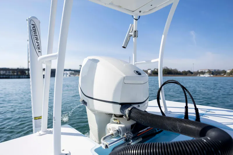Slide: The Image of 2015 East Cape Fury boat with Power-Pole, on calm water under clear sky. - 10
