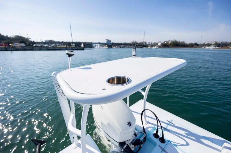 Slide: The Image of 2015 East Cape Fury boat on calm water, featuring a sleek design and modern equipment. - 11