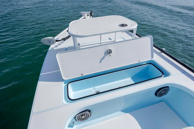 Slide: The Image of 2015 East Cape Fury boat deck with storage compartments on calm water. - 19