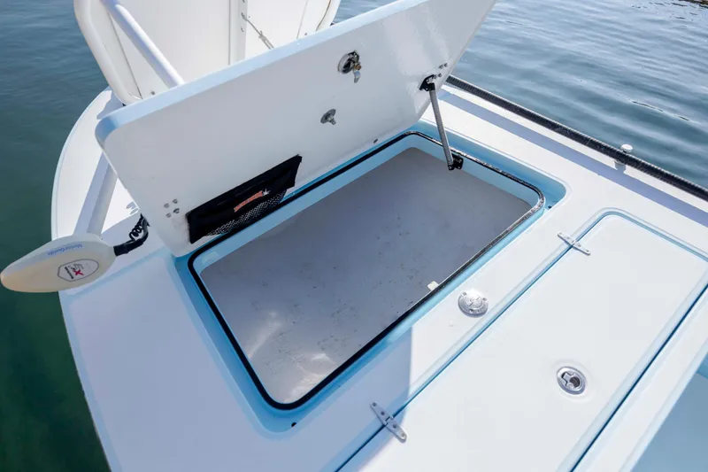 Slide: The Image of 2015 East Cape Fury boat storage compartment open on calm water. - 20