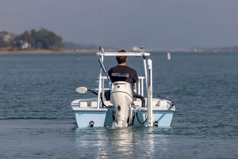 Slide: The Image of Man steering 2015 East Cape Fury boat on calm water. - 6