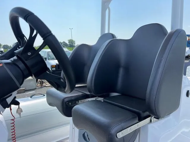 Slide: The Image of 2024 Highfield Sport 800 boat seats and steering wheel, showcasing modern design and comfort. - 10