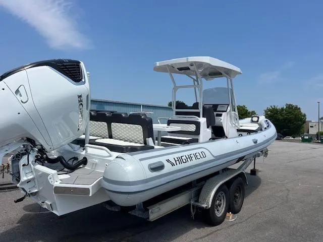 Slide: The Image of 2024 Highfield Sport 800 boat on trailer, featuring sleek design and powerful engine. - 3