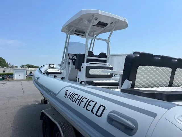 Slide: The Image of 2024 Highfield Sport 800 boat with sleek design, white exterior, and modern seating. - 5
