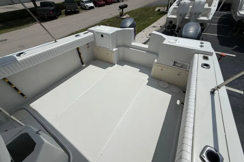 Slide: The Image of 1997 Glacier Bay 260 Canyon Runner boat interior with spacious deck and seating. - 10
