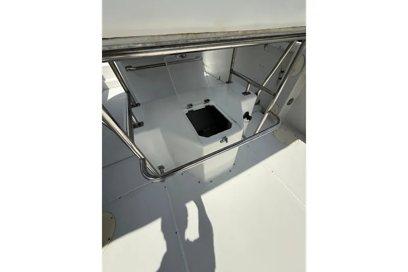 Slide: The Image of 1997 Glacier Bay 260 Canyon Runner boat interior with stainless steel railings and hatch. - 6