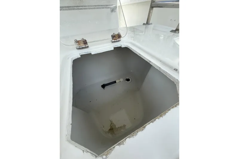 Slide: The Image of Open storage compartment on 1997 Glacier Bay 260 Canyon Runner boat. - 7