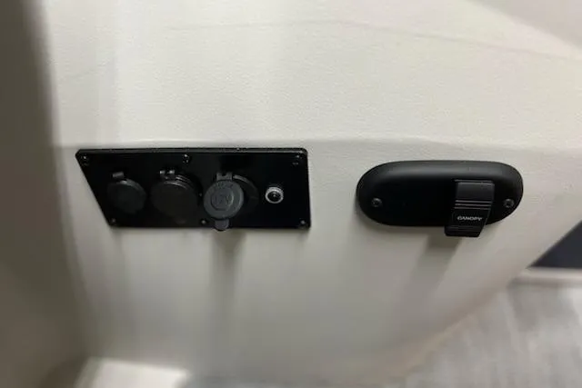 Slide: The Image of 2026 Sweetwater 2286C pontoon boat in indoor storage, featuring sleek design and modern amenities. - 5