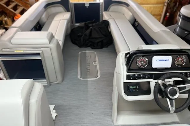 Slide: The Image of Lowrance display on 2026 Sweetwater 2286C dashboard with Godfrey logo. - 8