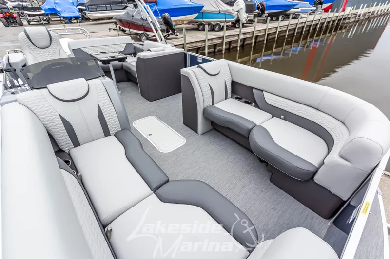 Slide: The Image of Luxurious interior of 2025 Godfrey Monaco 235 SFL pontoon boat at marina. - 12