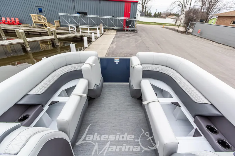 Slide: The Image of 2025 Godfrey Monaco 235 SFL pontoon boat interior with luxurious seating at Lakeside Marina. - 15