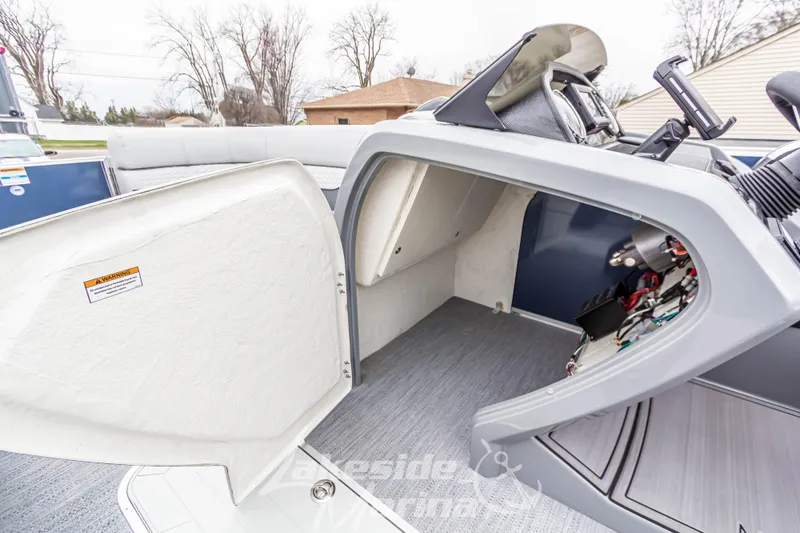 Slide: The Image of 2025 Godfrey Monaco 235 SFL boat interior storage compartment with open hatch. - 19