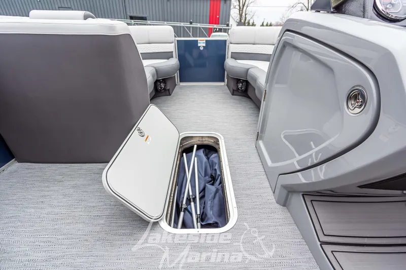 Slide: The Image of 2025 Godfrey Monaco 235 SFL boat interior with open storage compartment. - 20