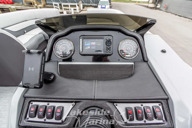 Slide: The Image of Dashboard of 2025 Godfrey Monaco 235 SFL boat with gauges and control panel. - 21
