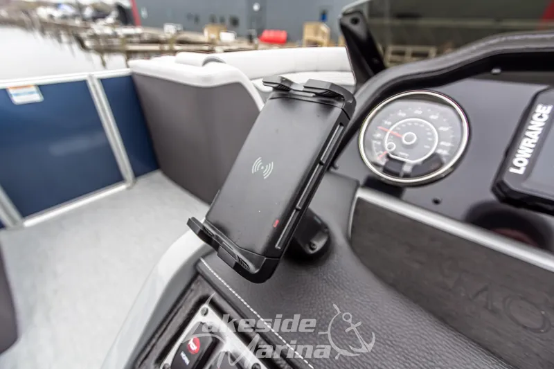 Slide: The Image of 2025 Godfrey Monaco 235 SFL dashboard with phone holder and speedometer. - 23