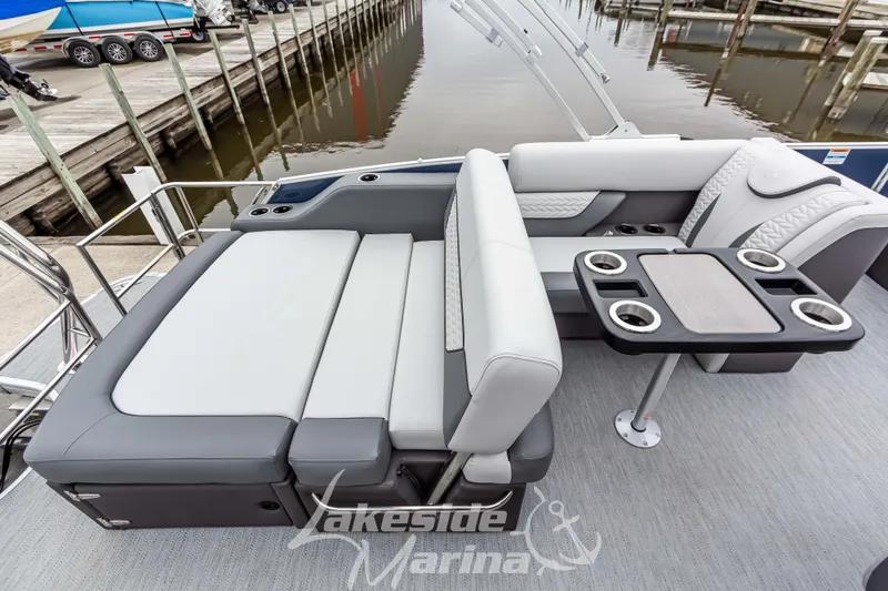 Slide: The Image of 2025 Godfrey Monaco 235 SFL boat interior with luxurious seating and table setup. - 27