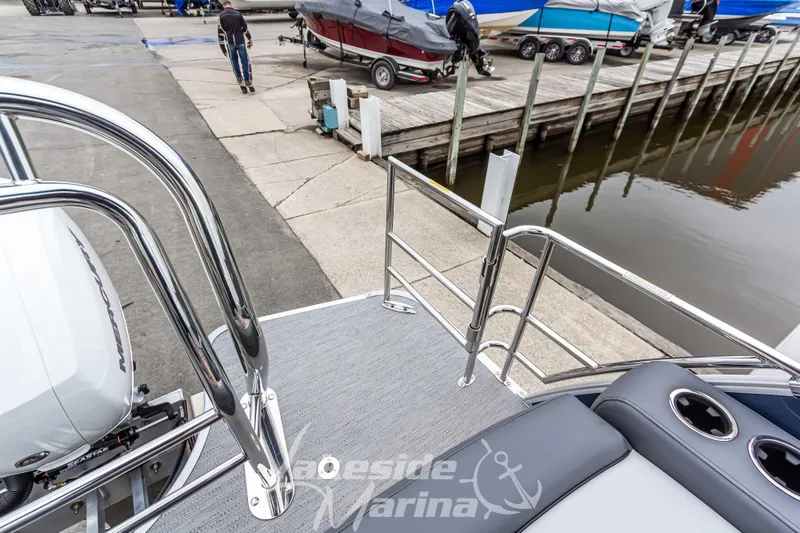 Slide: The Image of 2025 Godfrey Monaco 235 SFL at marina dock, showcasing sleek design and modern features. - 35