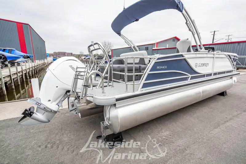 Slide: The Image of 2025 Godfrey Monaco 235 SFL pontoon boat with outboard motor at Lakeside Marina. - 4