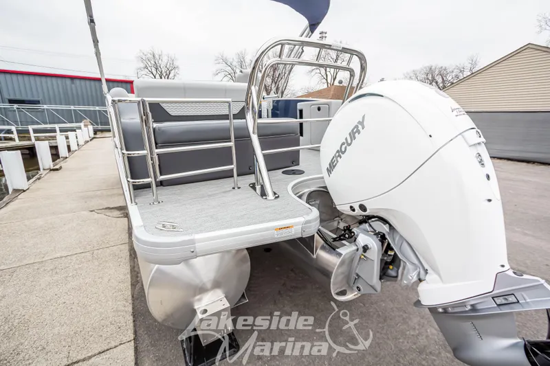 Slide: The Image of 2025 Godfrey Monaco 235 SFL pontoon boat with Mercury outboard engine at marina. - 7