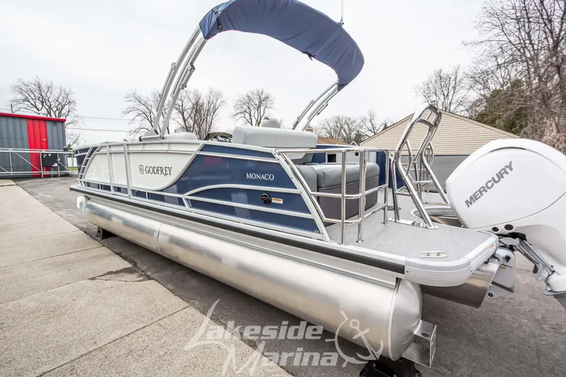 Slide: The Image of 2025 Godfrey Monaco 235 SFL pontoon boat with Mercury engine at Lakeside Marina. - 8