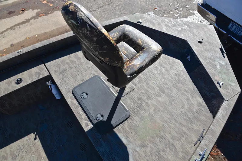 Slide: The Image of 2017 G3 Bay 20 DLX Camo boat with camo seat and deck. - 27