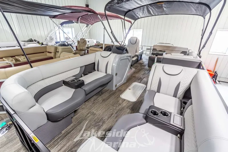Slide: The Image of 2025 Godfrey Monaco 235 SFL pontoon boat interior with luxurious seating and modern design. - 11