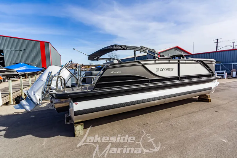 Slide: The Image of 2025 Godfrey Monaco 235 SFL pontoon boat displayed at Lakeside Marina. - 3