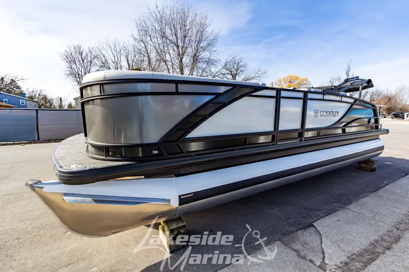 Slide: The Image of 2025 Godfrey Monaco 235 SFL pontoon boat displayed at Lakeside Marina. - 7