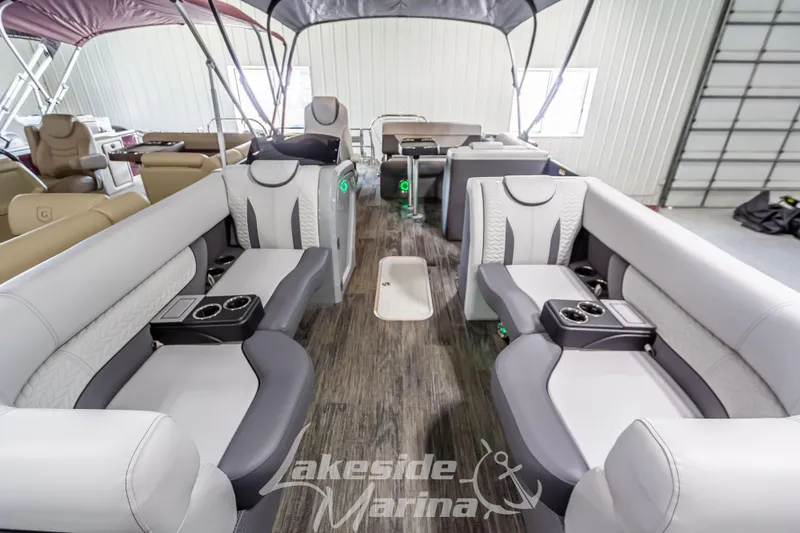 Slide: The Image of 2025 Godfrey Monaco 235 SFL pontoon boat interior with luxurious seating and cup holders. - 9