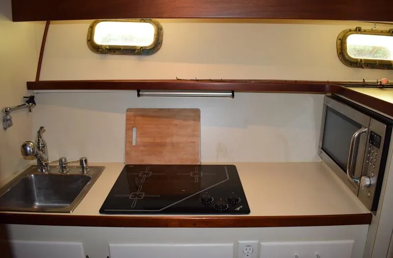 Slide: The Image of Kitchen area in a 1960 Rybovich Sportfisherman yacht. - 14