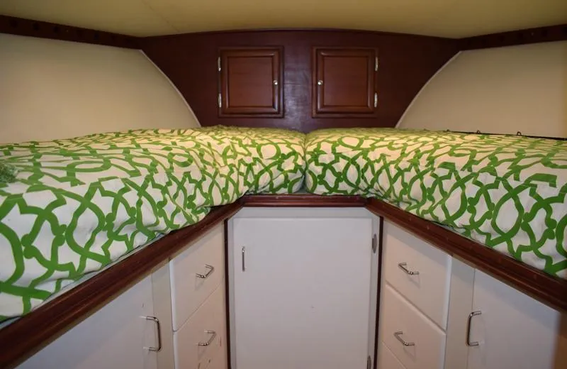 Slide: The Image of Interior of a 1960 Rybovich Sportfisherman with green bedding. - 20