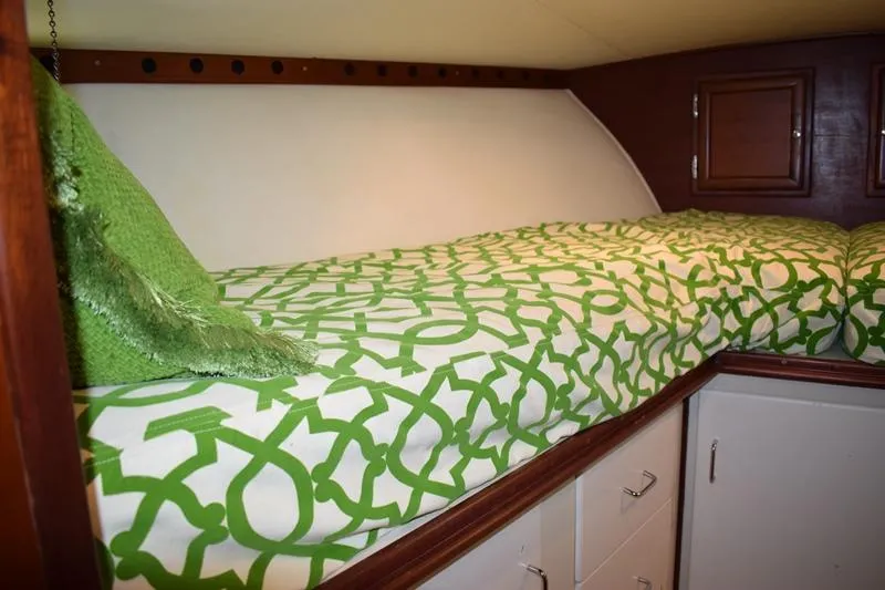 Slide: The Image of Interior of a 1960 Rybovich Sportfisherman with green bedding. - 21