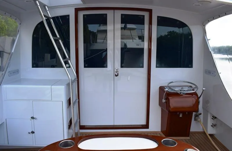 Slide: The Image of 1960 Rybovich Sportfisherman yacht interior with helm station. - 27