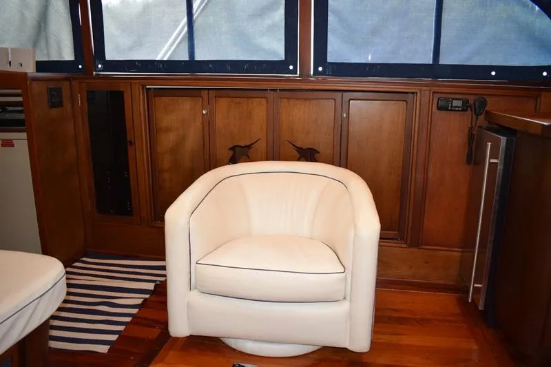 Slide: The Image of Interior of a 1960 Rybovich Sportfisherman with white armchair. - 7