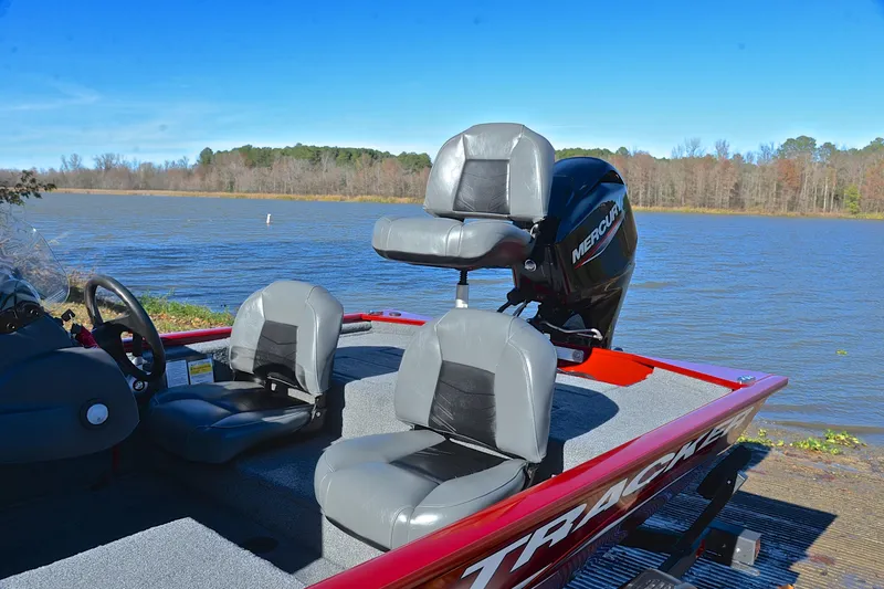 Slide: The Image of 2024 Tracker Pro 170 boat with Mercury engine by a scenic lake. - 18