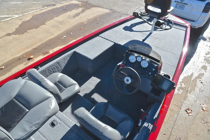 Slide: The Image of 2024 Tracker Pro 170 boat interior with steering console and seating. - 21