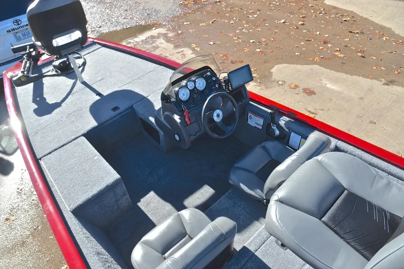 Slide: The Image of 2024 Tracker Pro 170 boat interior with steering console and seating. - 22