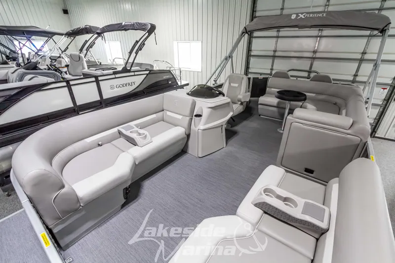 Slide: The Image of 2025 Godfrey Sweetwater 2286 FSX pontoon boat interior with plush seating and modern design. - 12