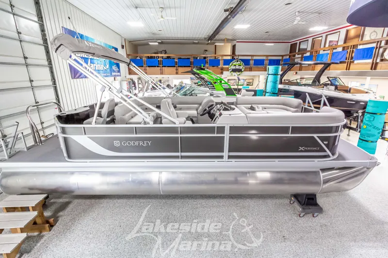 Slide: The Image of 2025 Godfrey Sweetwater 2286 FSX pontoon boat in showroom. - 2