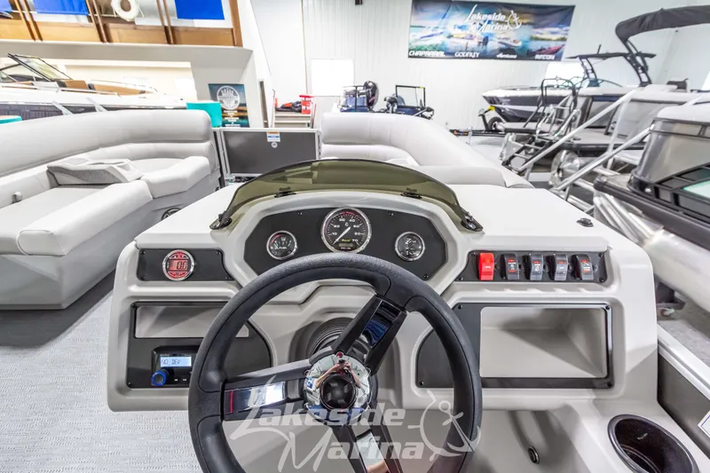 Slide: The Image of 2025 Godfrey Sweetwater 2286 FSX boat dashboard with steering wheel and controls. - 22