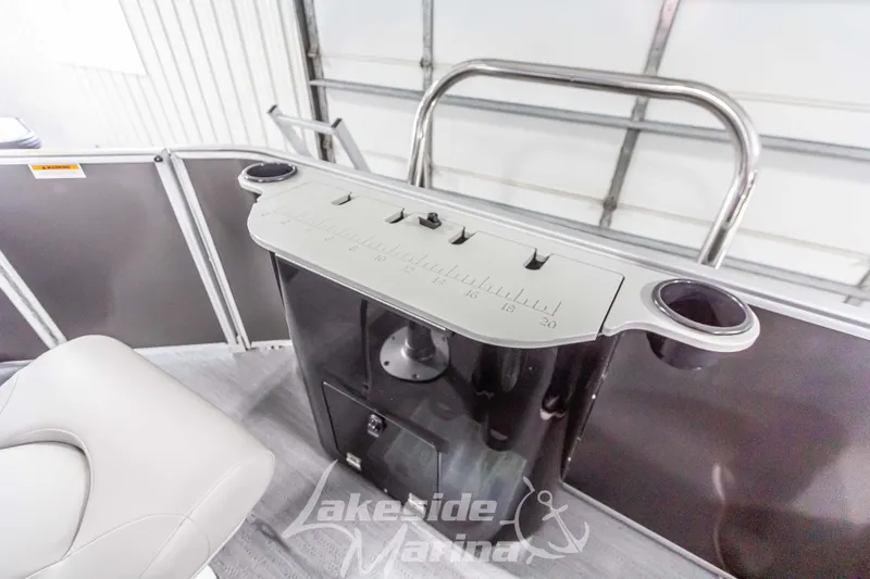 Slide: The Image of 2025 Godfrey Sweetwater 2286 FSX boat interior with cup holders and storage. - 35