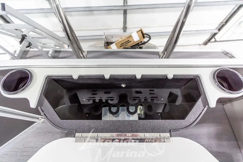 Slide: The Image of Godfrey Sweetwater 2286 FSX 2025 boat interior with storage compartment and cup holders. - 37