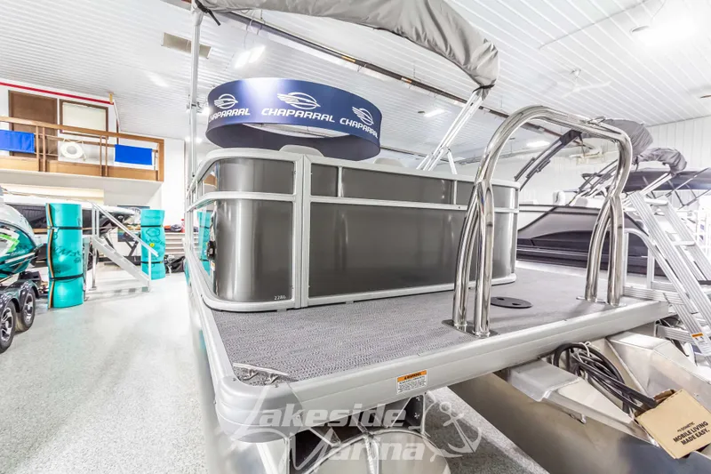 Slide: The Image of 2025 Godfrey Sweetwater 2286 FSX pontoon boat in showroom, featuring sleek design and modern amenities. - 5