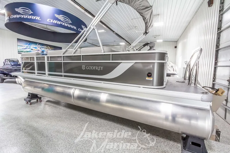 Slide: The Image of 2025 Godfrey Sweetwater 2286 FSX pontoon boat in showroom, silver exterior. - 6