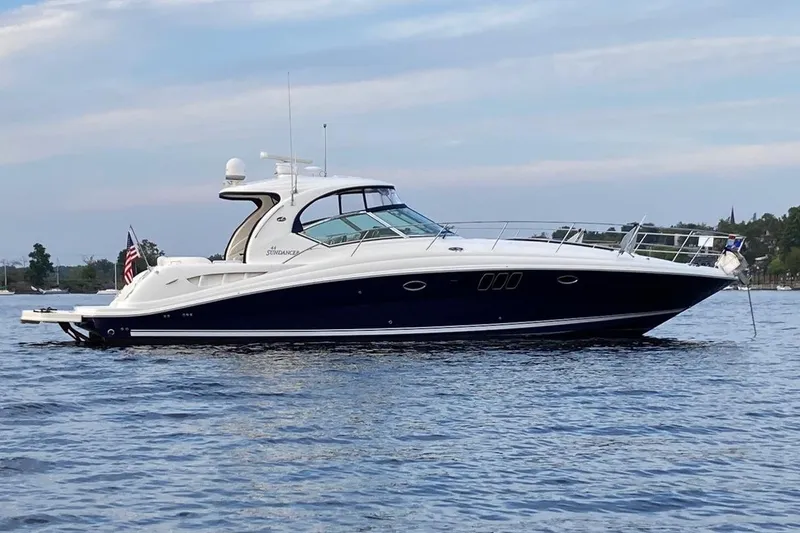 The Image of 2008 Sea Ray 44 Sundancer yacht on calm water, side view. - 0