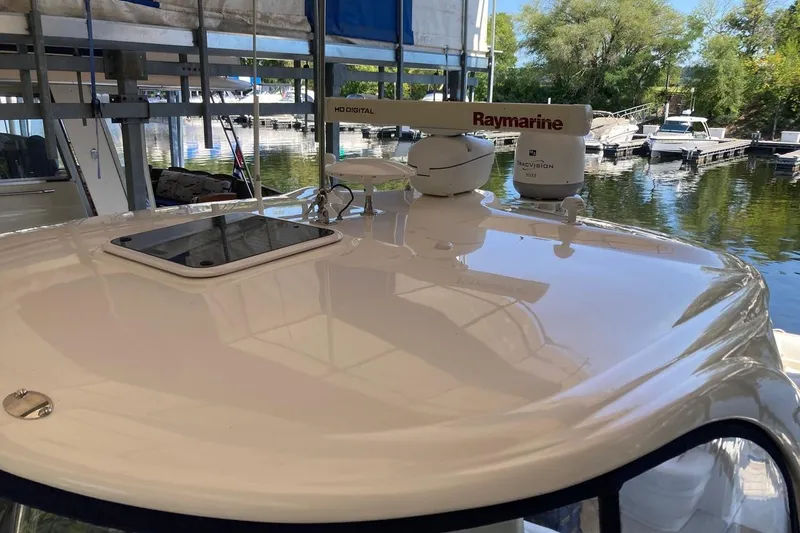 Slide: The Image of 2008 Sea Ray 44 Sundancer yacht with Raymarine radar, docked at a marina. - 16